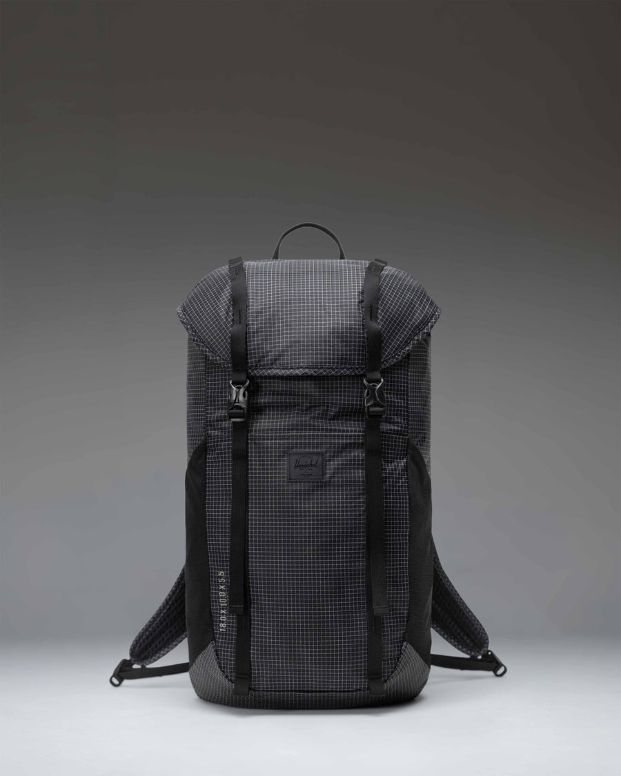 Black Herschel Supply Co Ultralight Backpack 22 L shown from the front with adjustable shoulder straps and top handle.