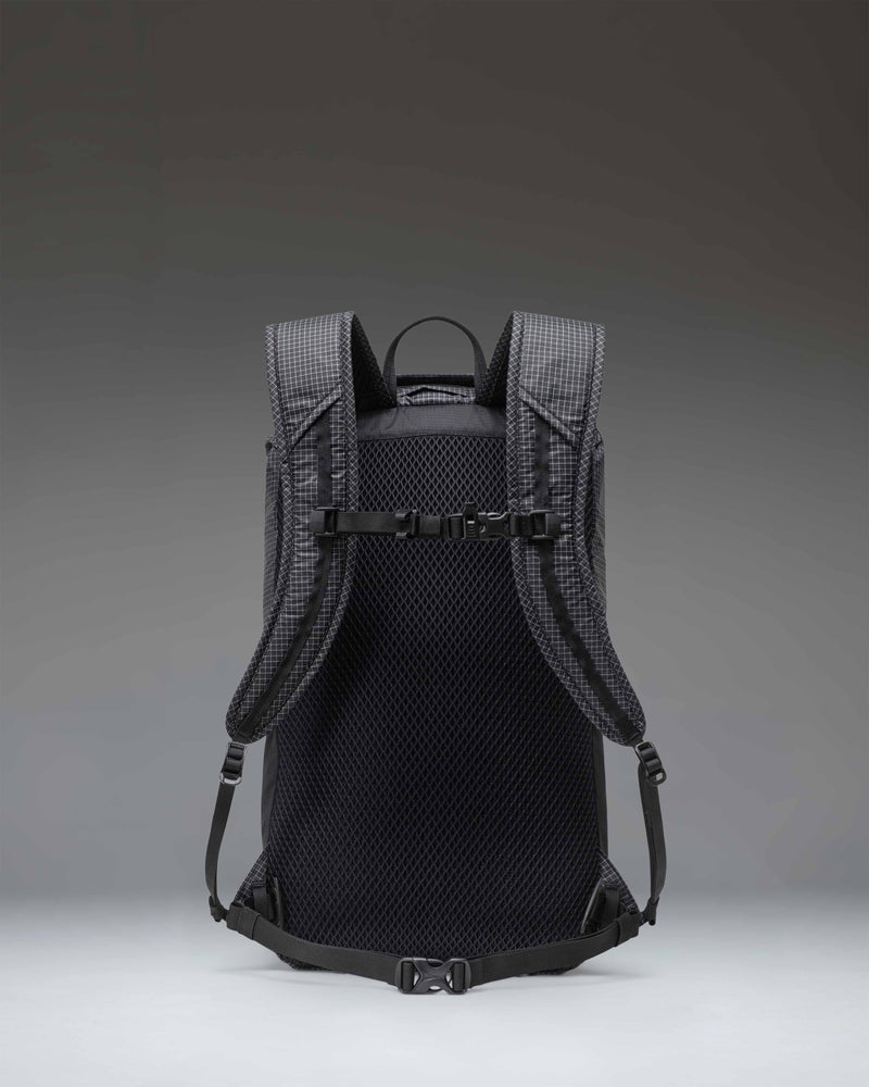 Black Herschel Supply Co. Ultralight Backpack 22L showing a sleek technical daypack design with a drawcord closure and mesh pockets.