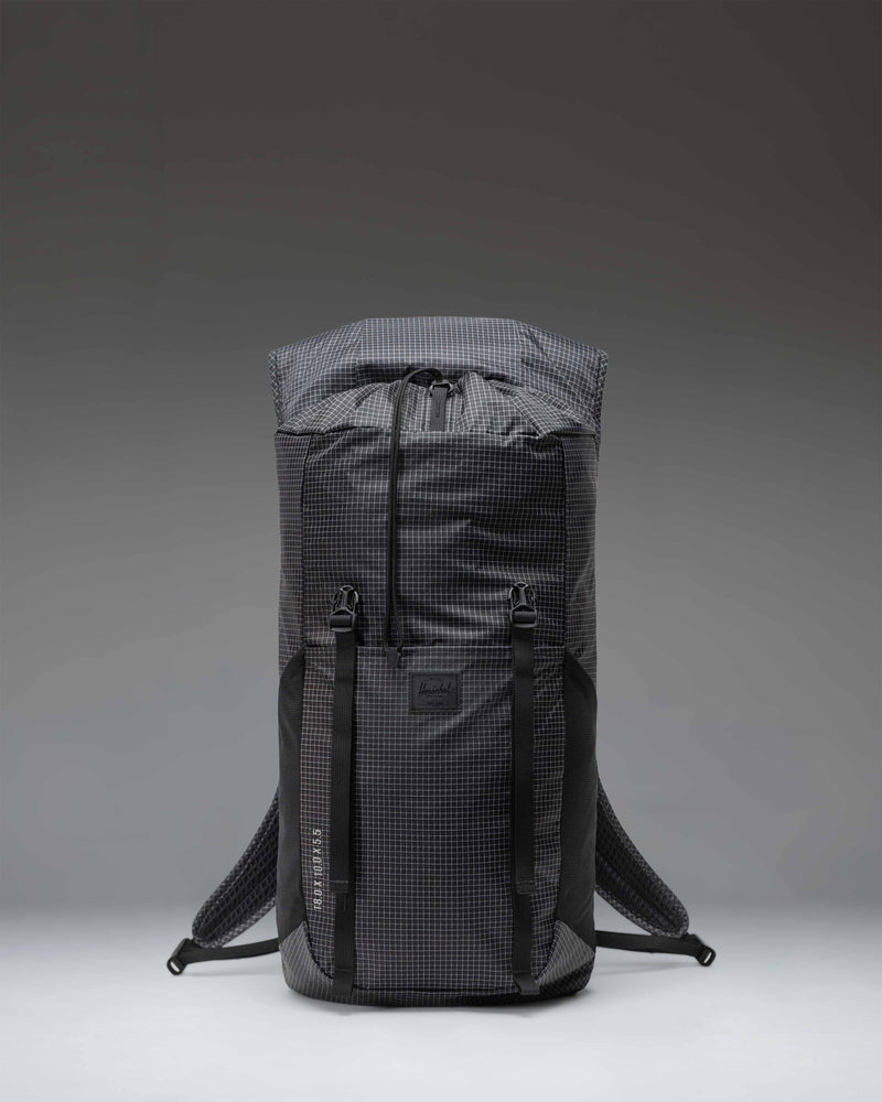 Black Herschel Supply Co. Ultralight Backpack 22L featuring lightweight ripstop fabric, drawcord closure, and adjustable mesh shoulder straps.