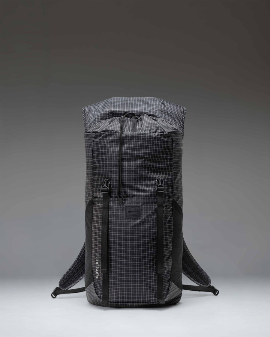 Black Herschel Supply Co. Ultralight Backpack 22L featuring lightweight ripstop fabric, drawcord closure, and adjustable mesh shoulder straps.