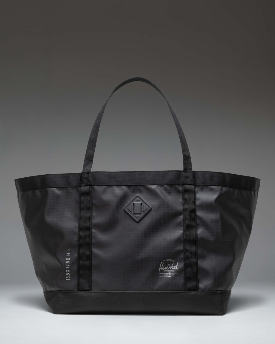 Herschel Supply Co. All Season Gear Tote 63L in black, shown from the front highlighting its large capacity and durable handles.