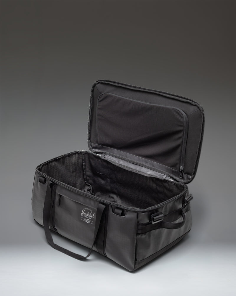 Herschel Supply Co. All Season Duffle 41L in Black, featuring a durable, minimalist design perfect for travel or daily use.