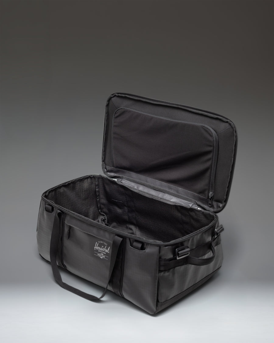 Herschel Supply Co. All Season Duffle 41L in Black, featuring a durable, minimalist design perfect for travel or daily use.
