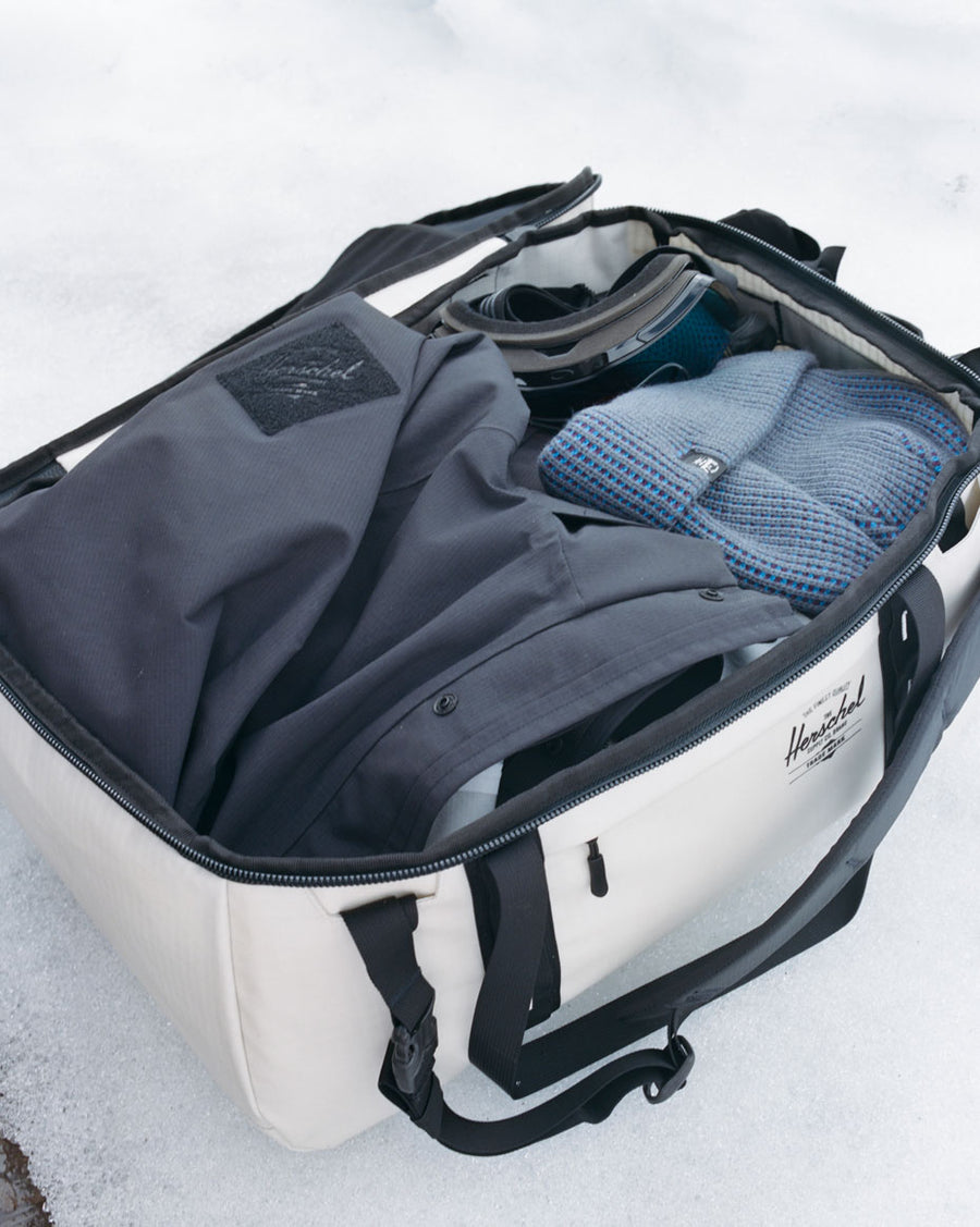 Herschel Supply Co. All Season Duffle 41L travel bag shown in an open, flat view displaying all available color options and patterns.