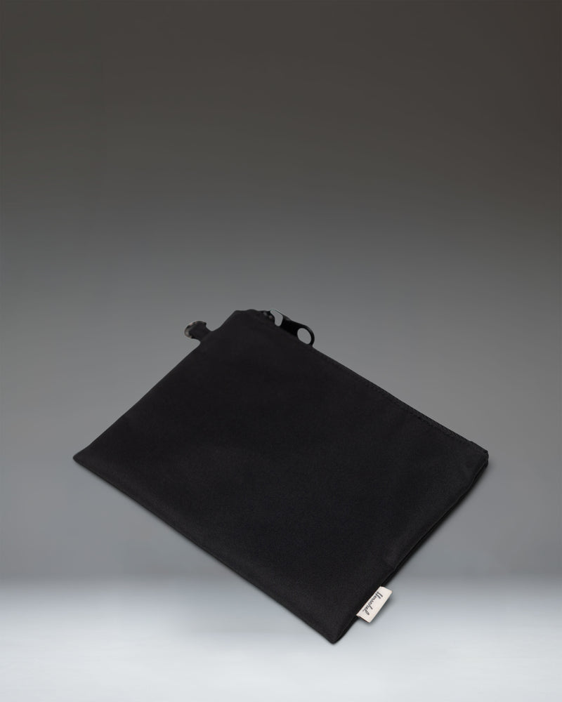 Herschel Supply Co. Yara Large Shoulder Bag in solid black, showcasing its spacious design and durable material for everyday use.