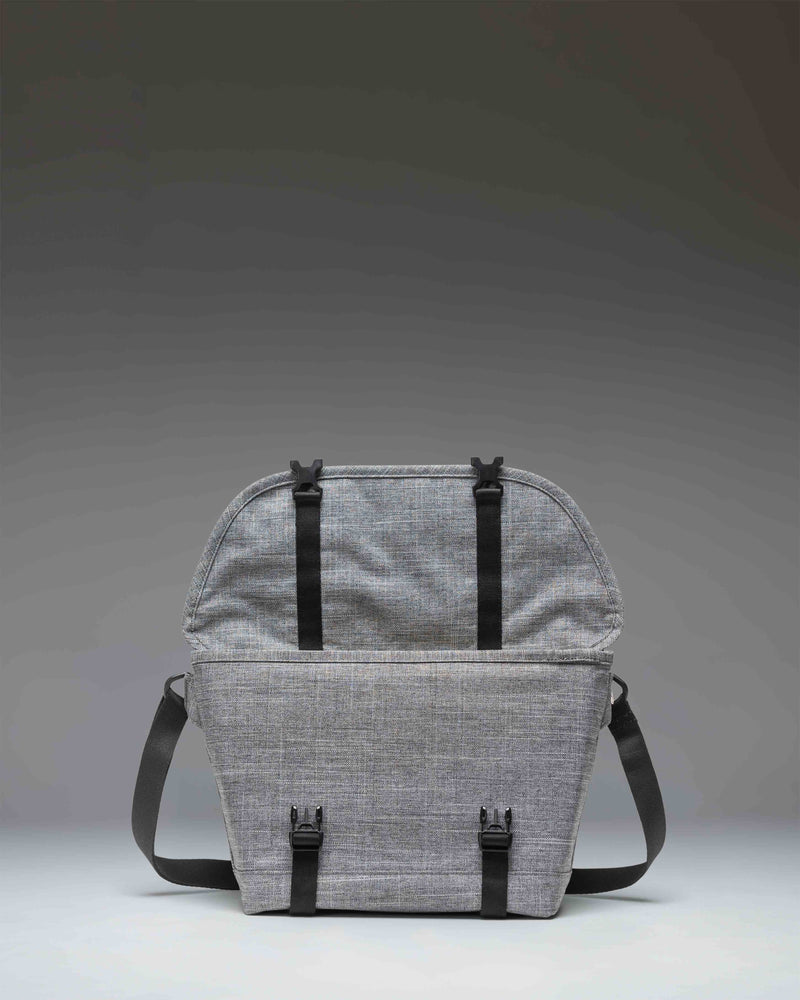 Herschel Supply Co. Cove Small Messenger bag in Raven Crosshatch grey, showing a front view with buckle closures.