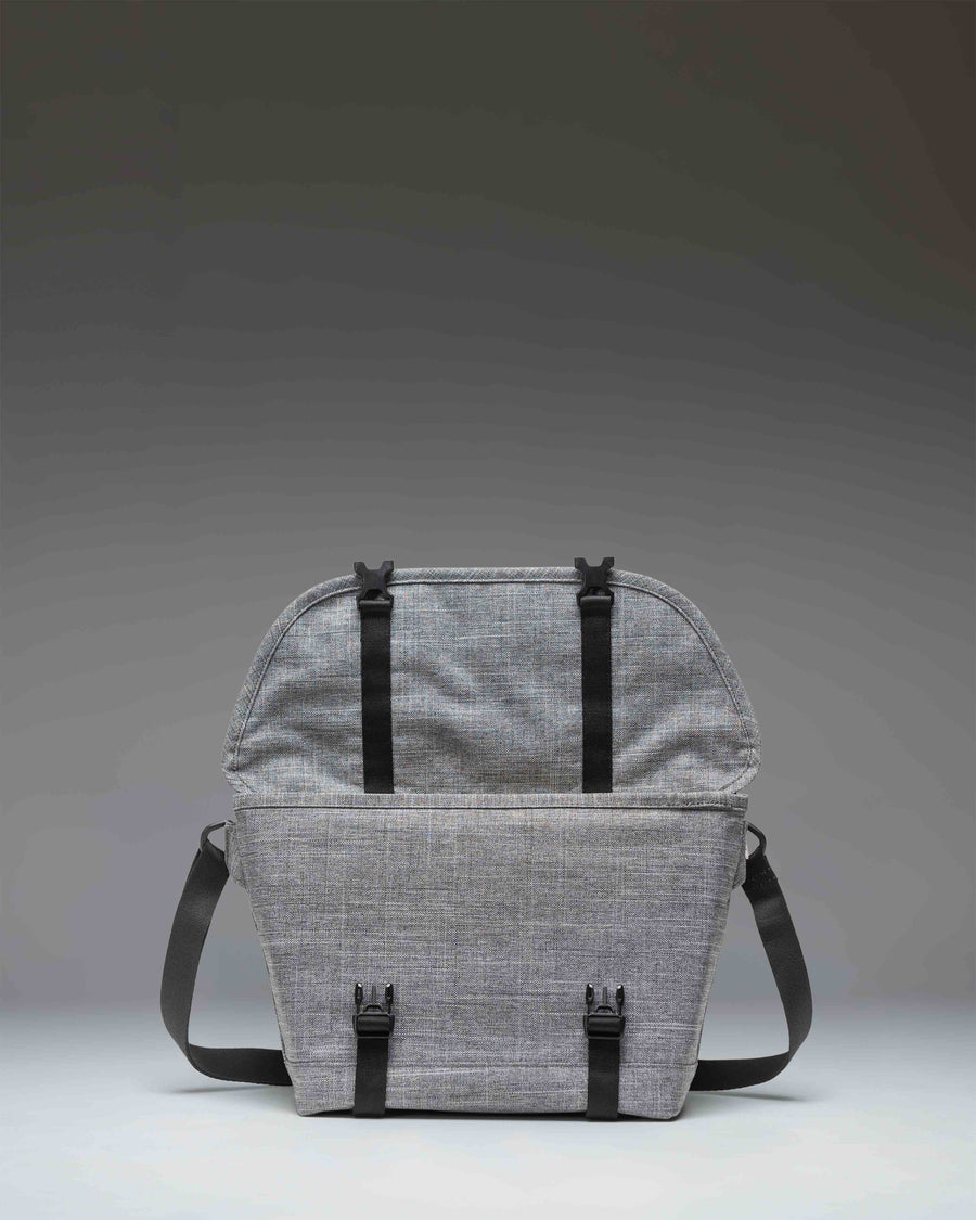 Herschel Supply Co. Cove Small Messenger bag in Raven Crosshatch grey, showing a front view with buckle closures.