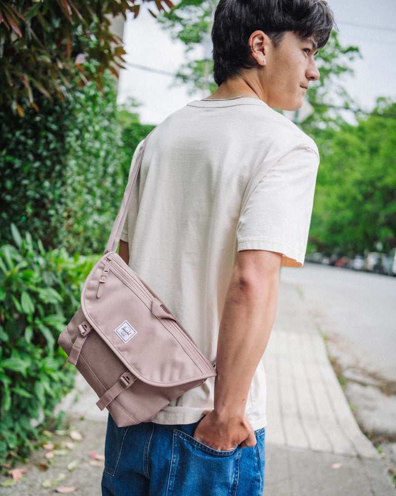 Herschel Supply Co. Cove Small Messenger bags displayed in a variety of colors to showcase the available collection options.