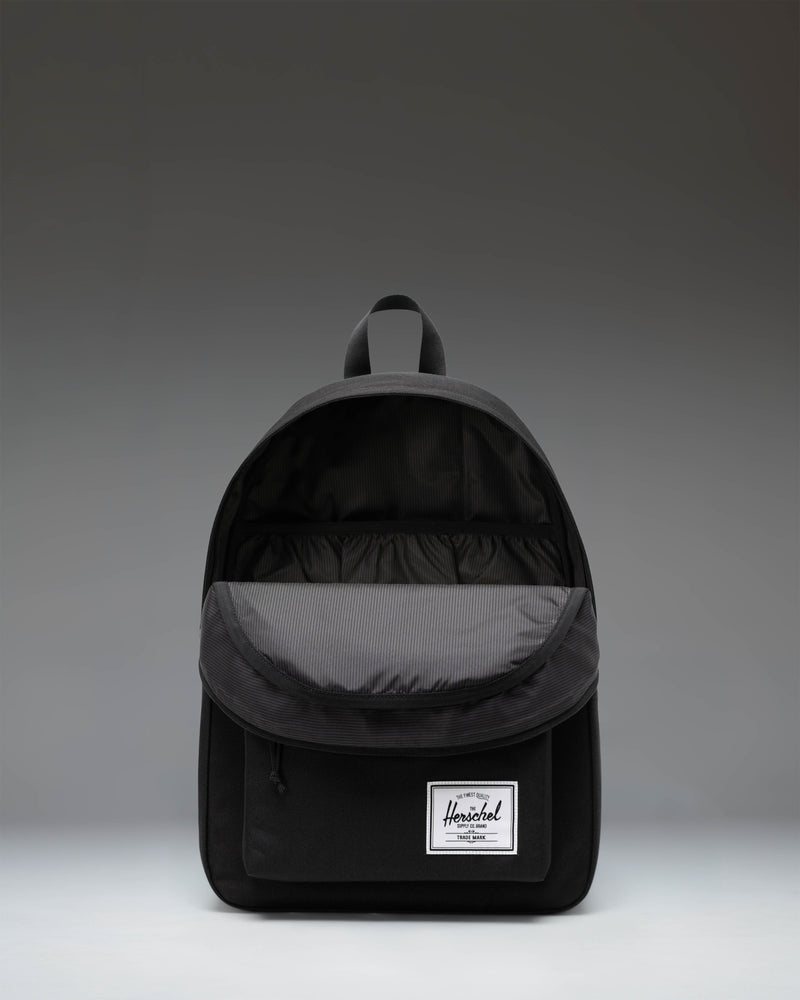 Black Herschel Classic Backpack showcasing its clean, timeless design and spacious main compartment.