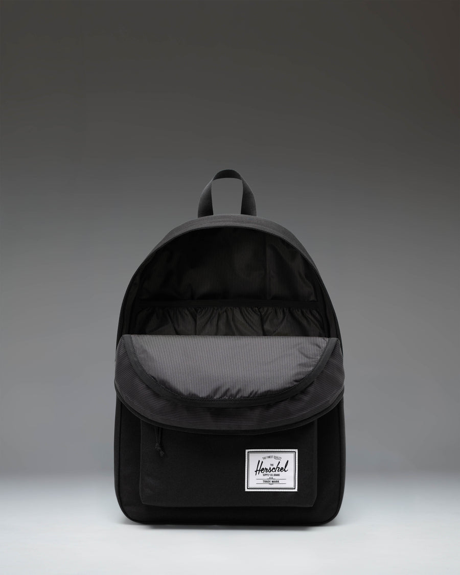 Black Herschel Classic Backpack showcasing its clean, timeless design and spacious main compartment.