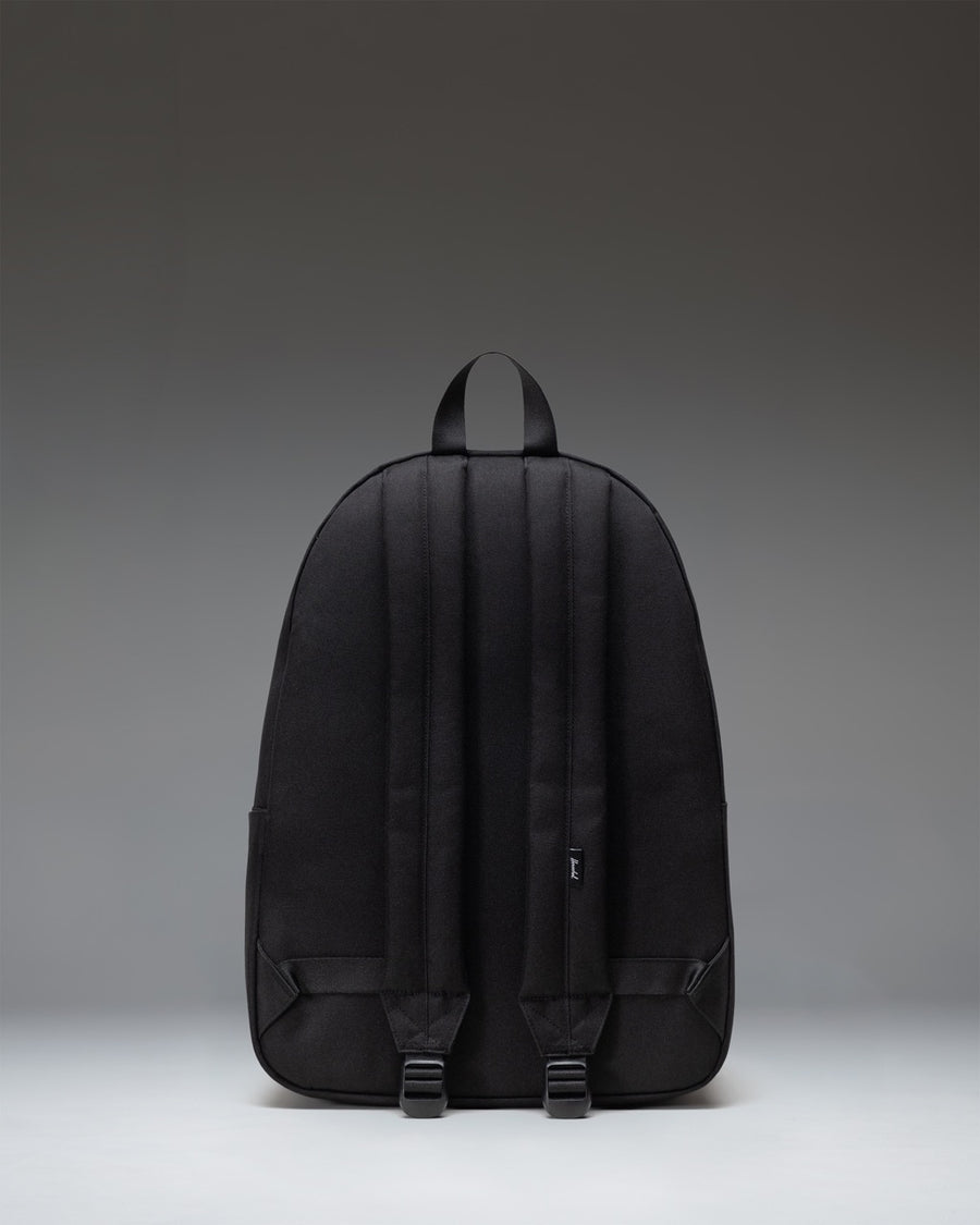 Herschel Classic XL Backpack in solid black, showing a clean front view with zippered pockets and a classic silhouette.
