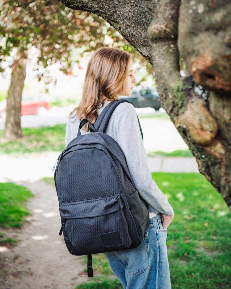 Herschel Supply Co. Classic XL Backpack in a multi-color grid pattern showing a lifestyle or product shot.
