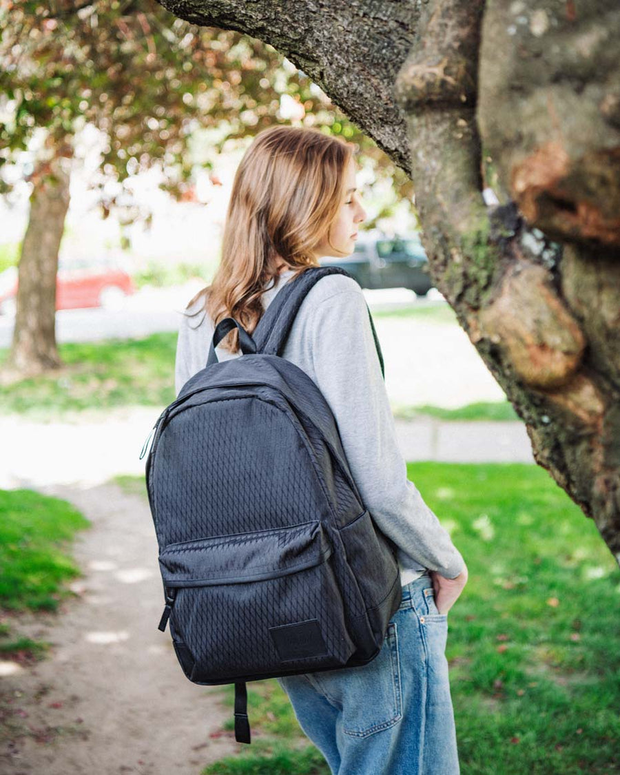 Herschel Supply Co. Classic XL Backpack in a multi-color grid pattern showing a lifestyle or product shot.