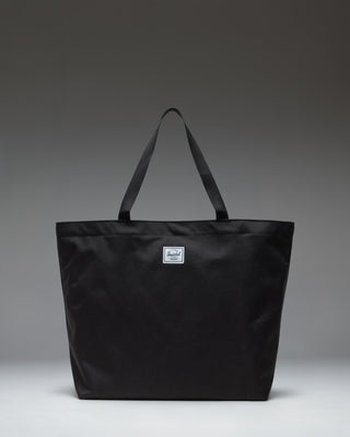 Herschel Classic Tote in Black, featuring a clean, minimalist design with dual top carrying handles.