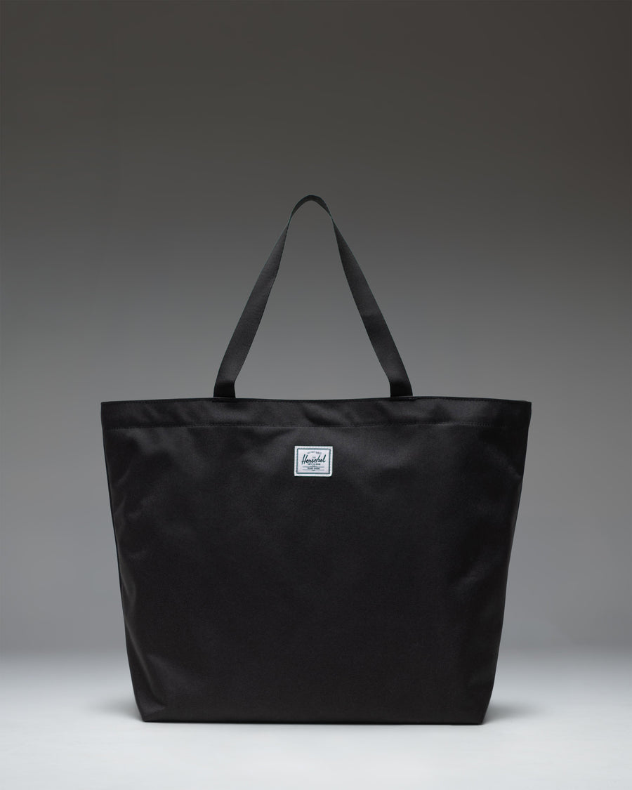 Herschel Classic Tote in Black, featuring a clean, minimalist design with dual top carrying handles.