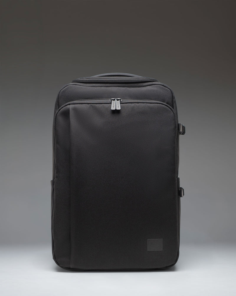 Black Herschel Supply Co. Kaslo Camera Bag Tech in black, showing the front view of the structured tech and camera crossbody bag.