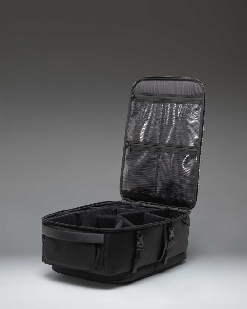 Herschel Supply Co. Kaslo Camera Bag Tech in black, featuring an organized interior layout for camera gear, lenses, and tech accessories.