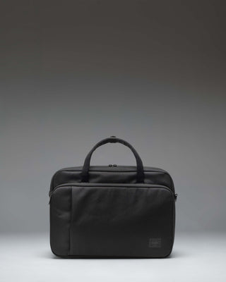 Herschel Supply Co. Gibson Messenger Tech bag in black, showing the front view with dual top handles, a removable shoulder strap, and front pockets.