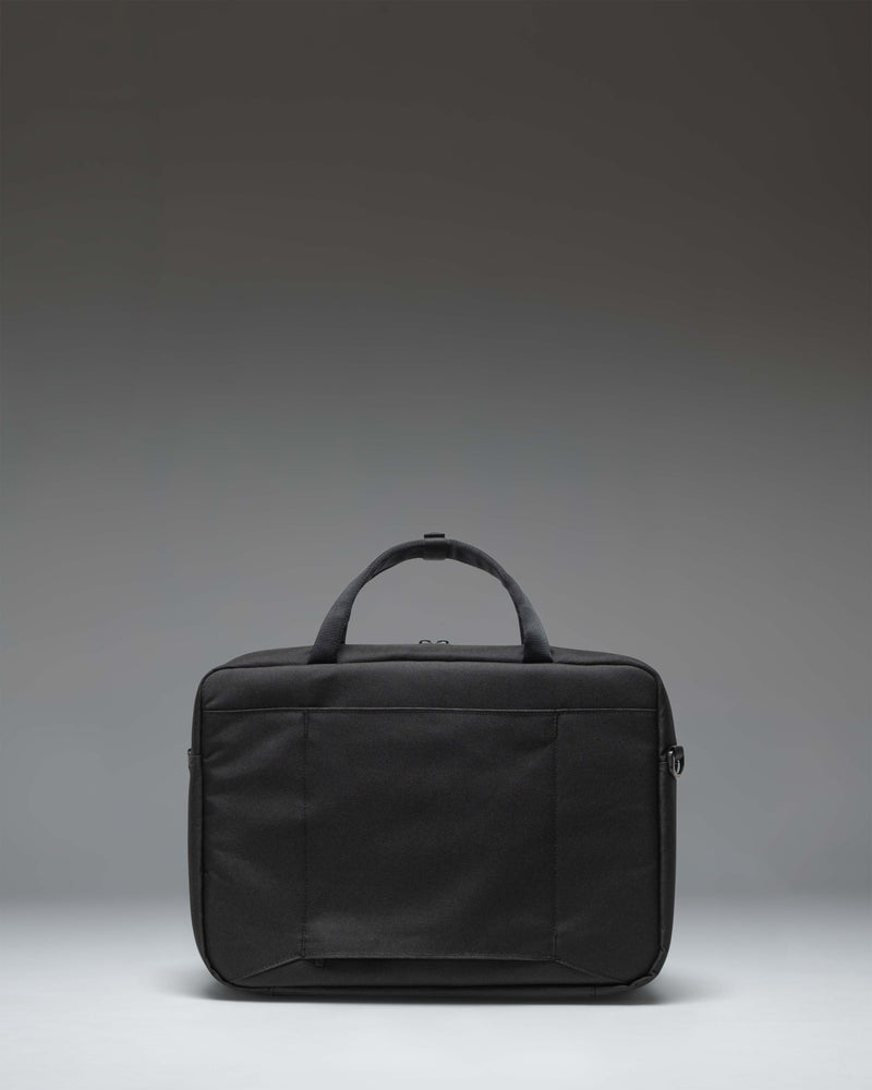 Herschel Supply Co. Gibson Messenger Tech bag in black, featuring dual top handles and a removable padded shoulder strap.