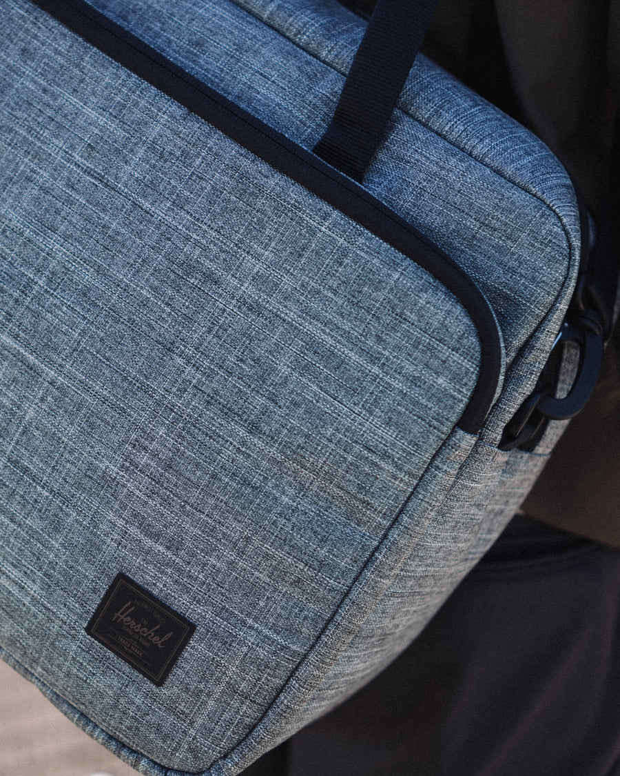 Herschel Supply Co. Gibson Messenger Tech bags displayed in multiple color options.