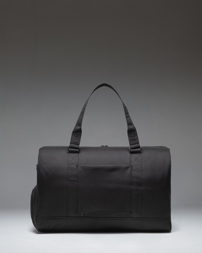 Black Herschel Novel Duffle Tech bag showcasing its sleek design, sturdy handles, and signature shoe compartment.