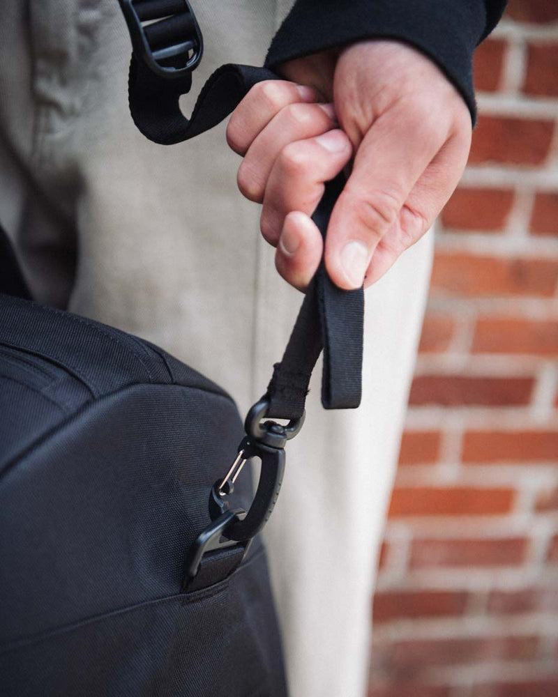 Herschel Supply Co. Novel Duffle Tech travel bags arranged together in a variety of available colors.