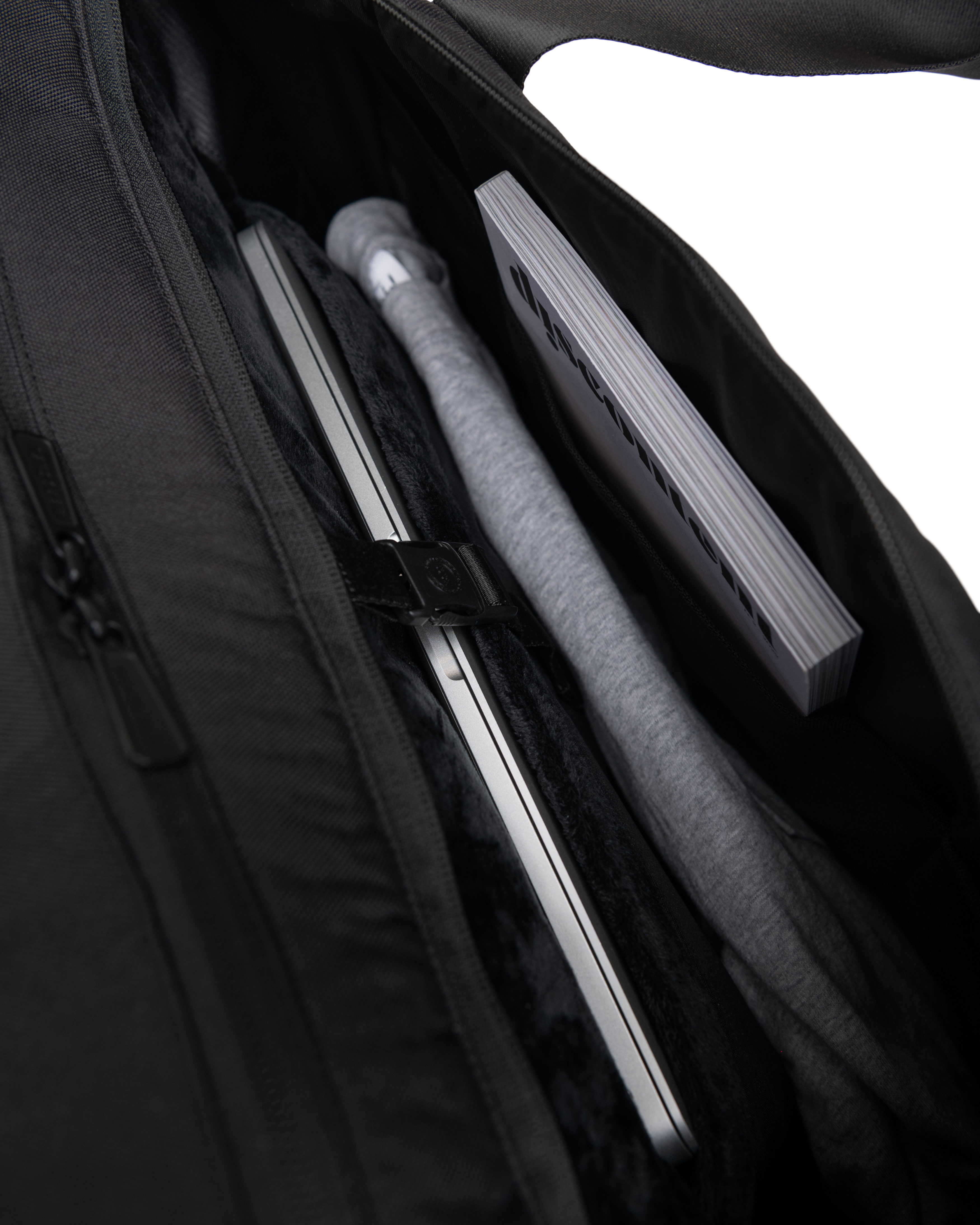 Herschel Novel Duffle Tech featuring specialized storage compartments, comfortable carrying handles, and a durable, functional design.