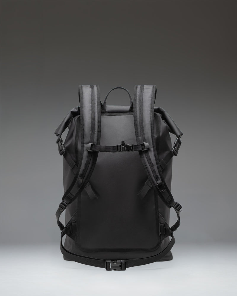 Herschel Outdoor Equipment Dry Bag Backpack 32L in black, featuring a waterproof roll-top closure and a front zippered pocket.