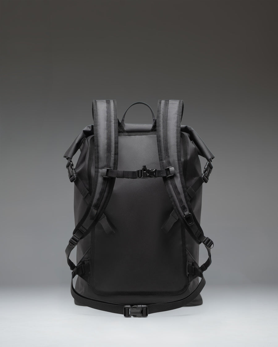 Herschel Outdoor Equipment Dry Bag Backpack 32L in black, featuring a waterproof roll-top closure and a front zippered pocket.