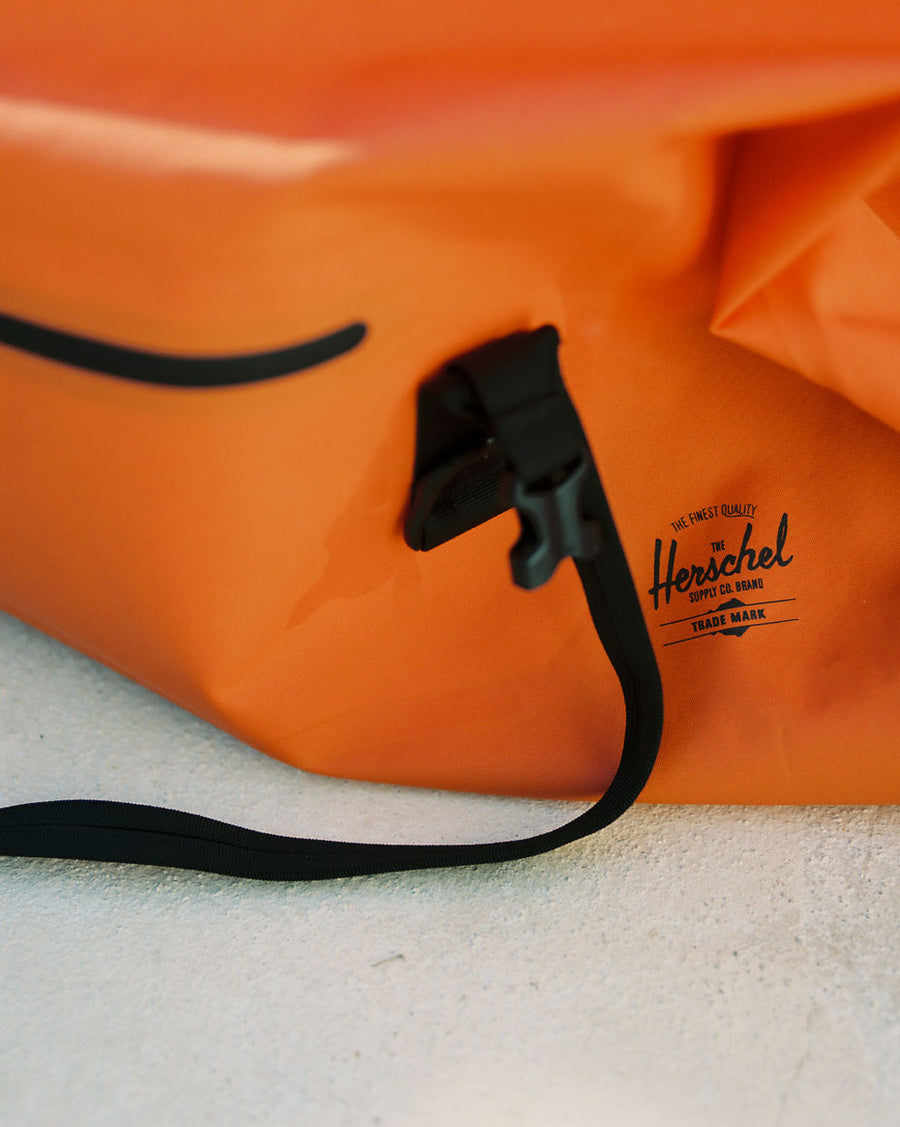 Herschel Supply Co. Dry Bag Duffle 55L waterproof bags displayed in multiple color options.