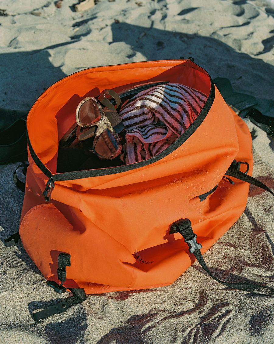 Herschel Supply Co. Dry Bag Duffle 55L in multiple colors displayed together to showcase the waterproof, roll-top design.