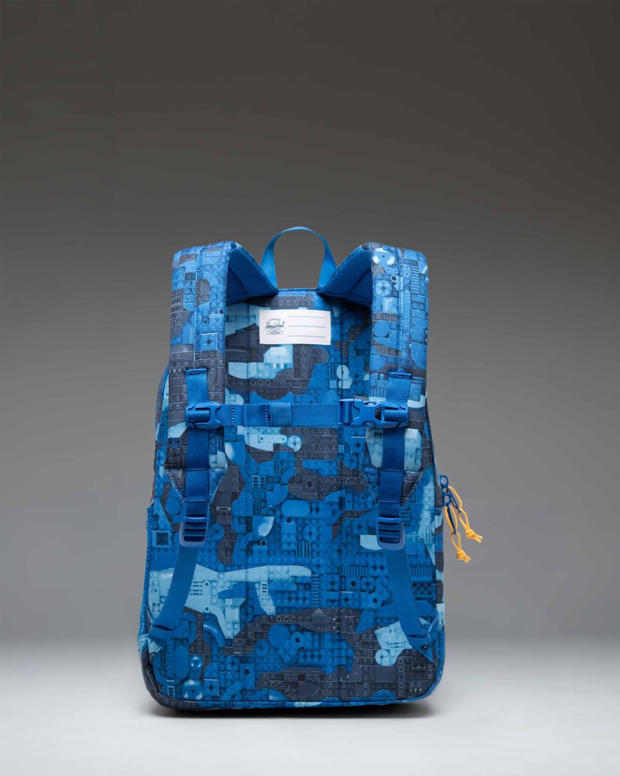 LEGO Herschel Heritage Youth Backpack in Abstract Bricks Blue featuring a colorful LEGO brick print.