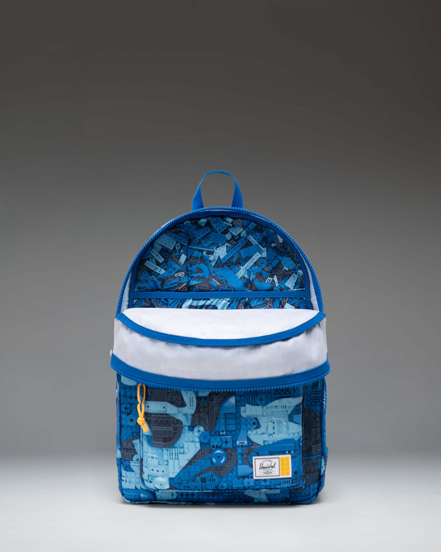 LEGO Herschel Heritage Youth Backpack in Abstract Bricks Blue featuring a colorful LEGO brick pattern.
