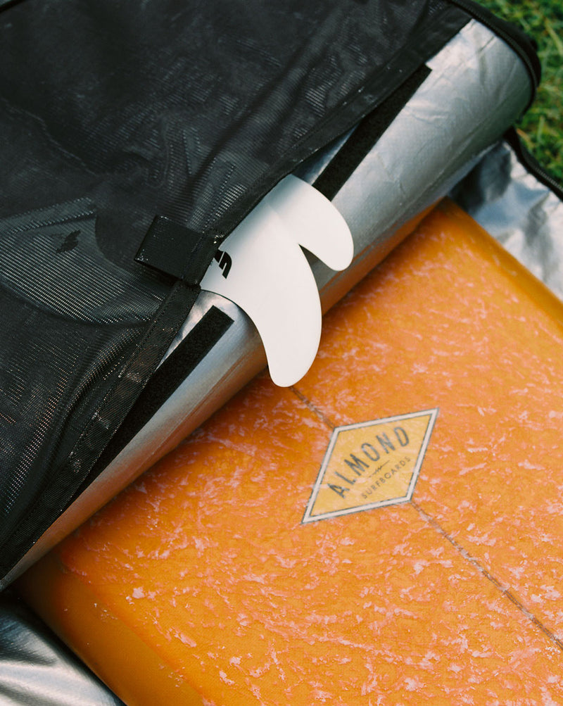 Herschel Supply Co. Surfboard Travel Bag Hybrid 6'6" shown in multiple colors, including black, camo, and green, arranged in a grid.