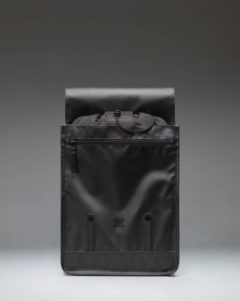 Herschel Survey Backpack in Black, featuring a classic dual-strap design with buckle closures and a clean, modern aesthetic.