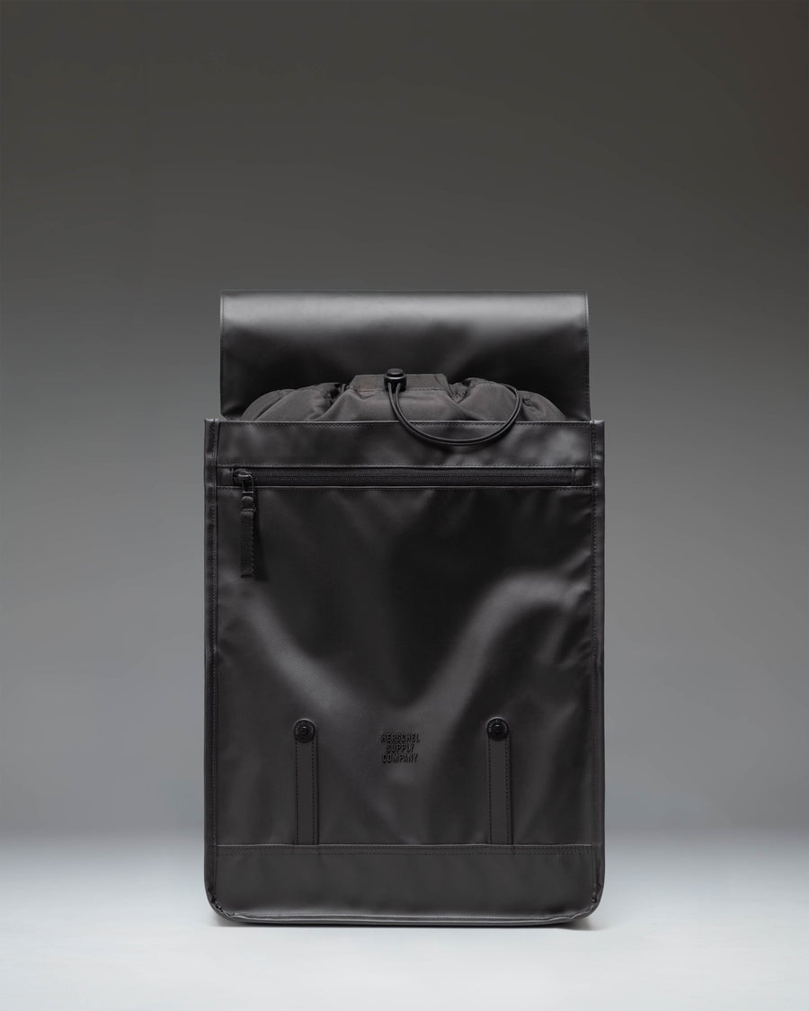 Herschel Survey Backpack in Black, featuring a classic dual-strap design with buckle closures and a clean, modern aesthetic.