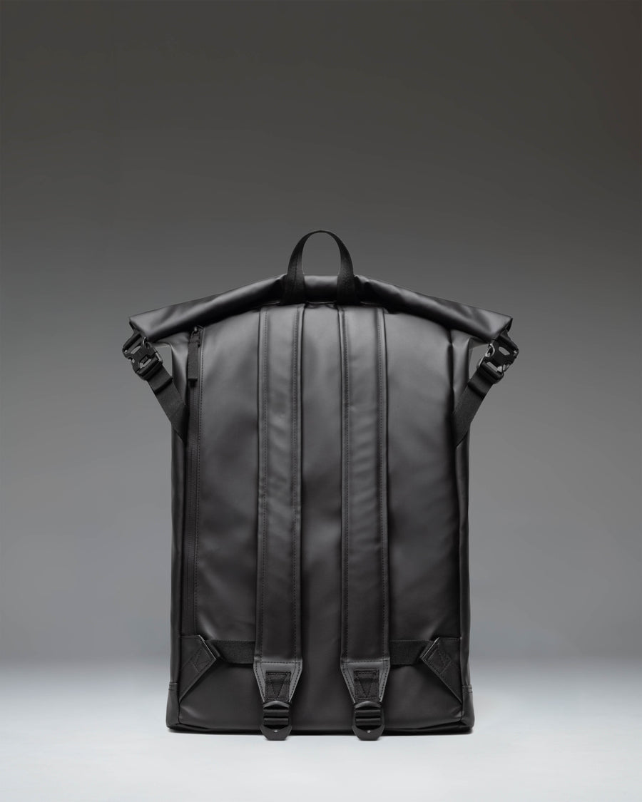 Herschel Supply Co. Roll Top Backpack in solid black, featuring its classic roll-top design and adjustable shoulder straps.