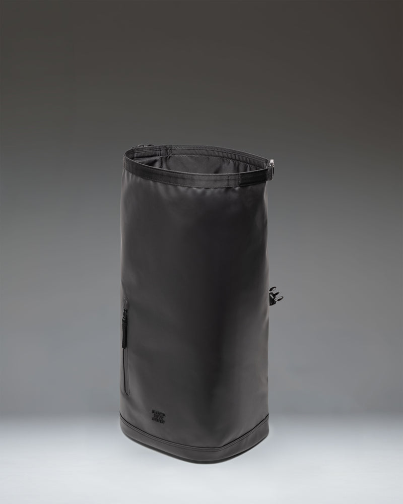 Herschel Supply Co. Roll Top Backpack in black, featuring an open main compartment, padded shoulder straps, and a clean, minimalist design.