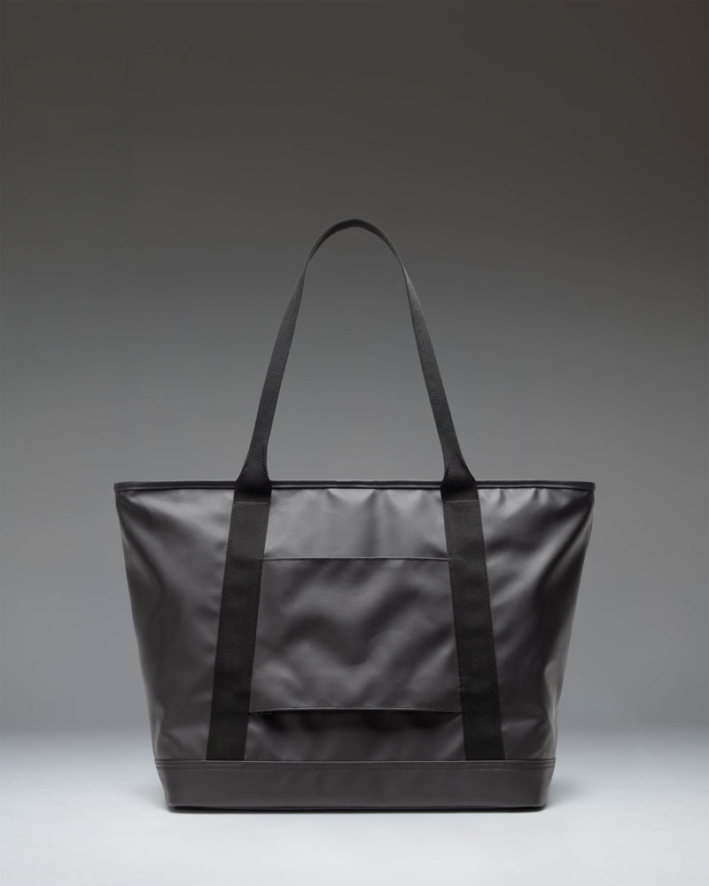 Herschel Supply Co. Alberni Tote bag in classic black, featuring a durable design with top handles for everyday carry.