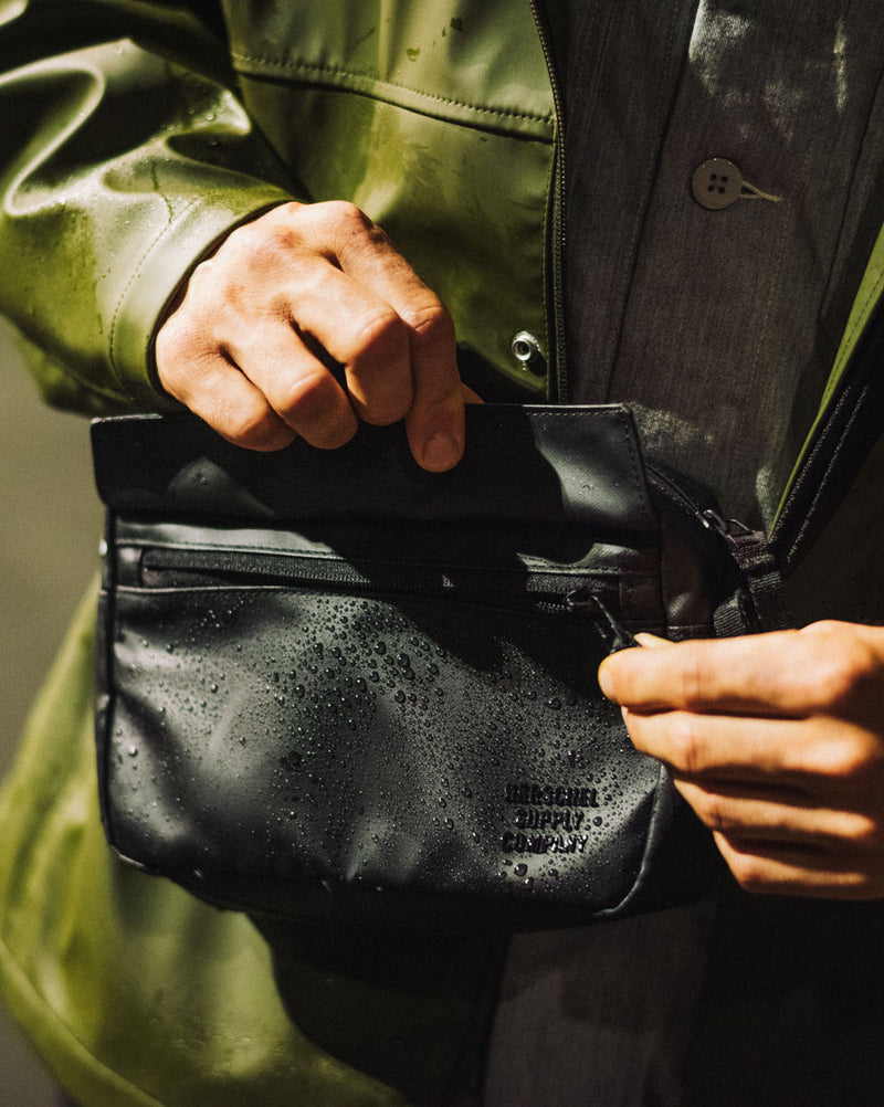 Herschel Supply Co. Alberni Crossbody bag size guide chart showing dimensions of 6 inches height, 8.5 inches width, and 3 inches depth.