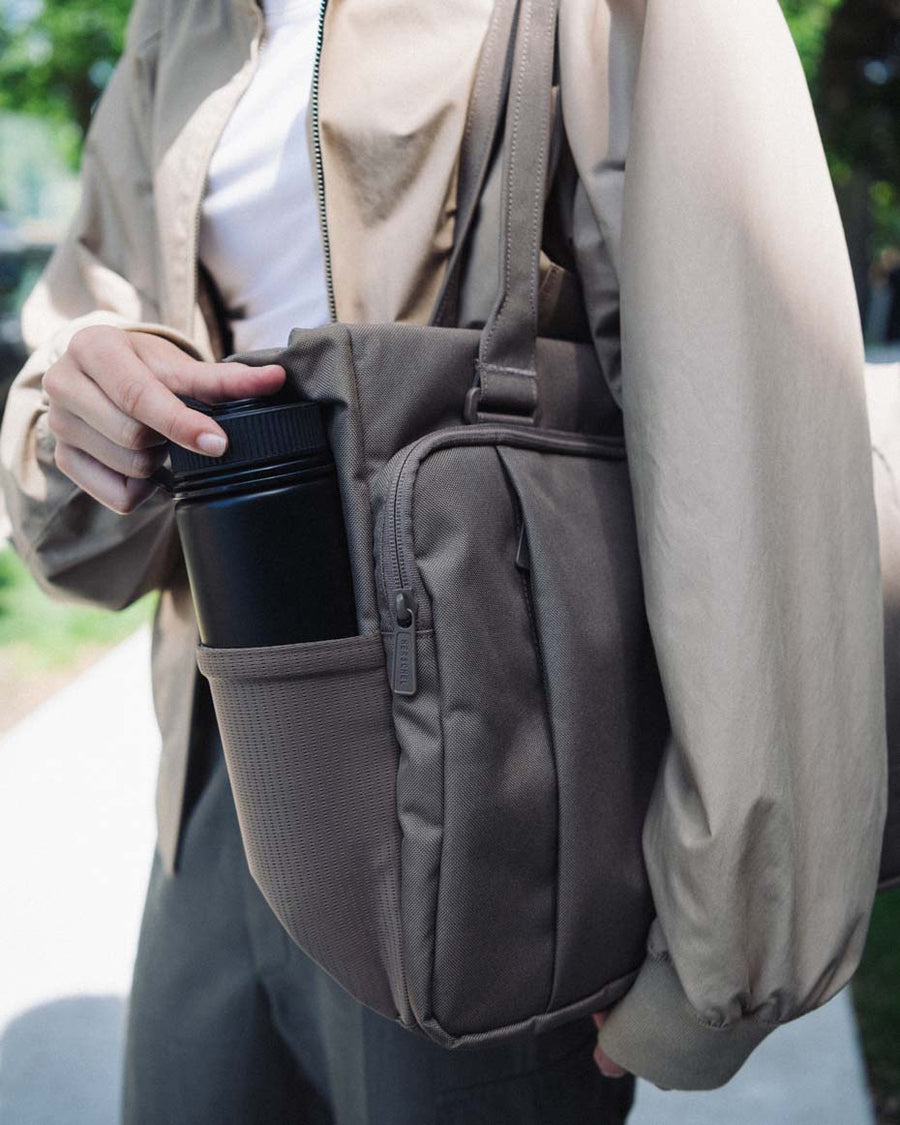 Herschel Supply Co. Kaslo Tech Tote bag in Black Tonal, shown from the front highlighting its sleek, organized, and minimalistic design.