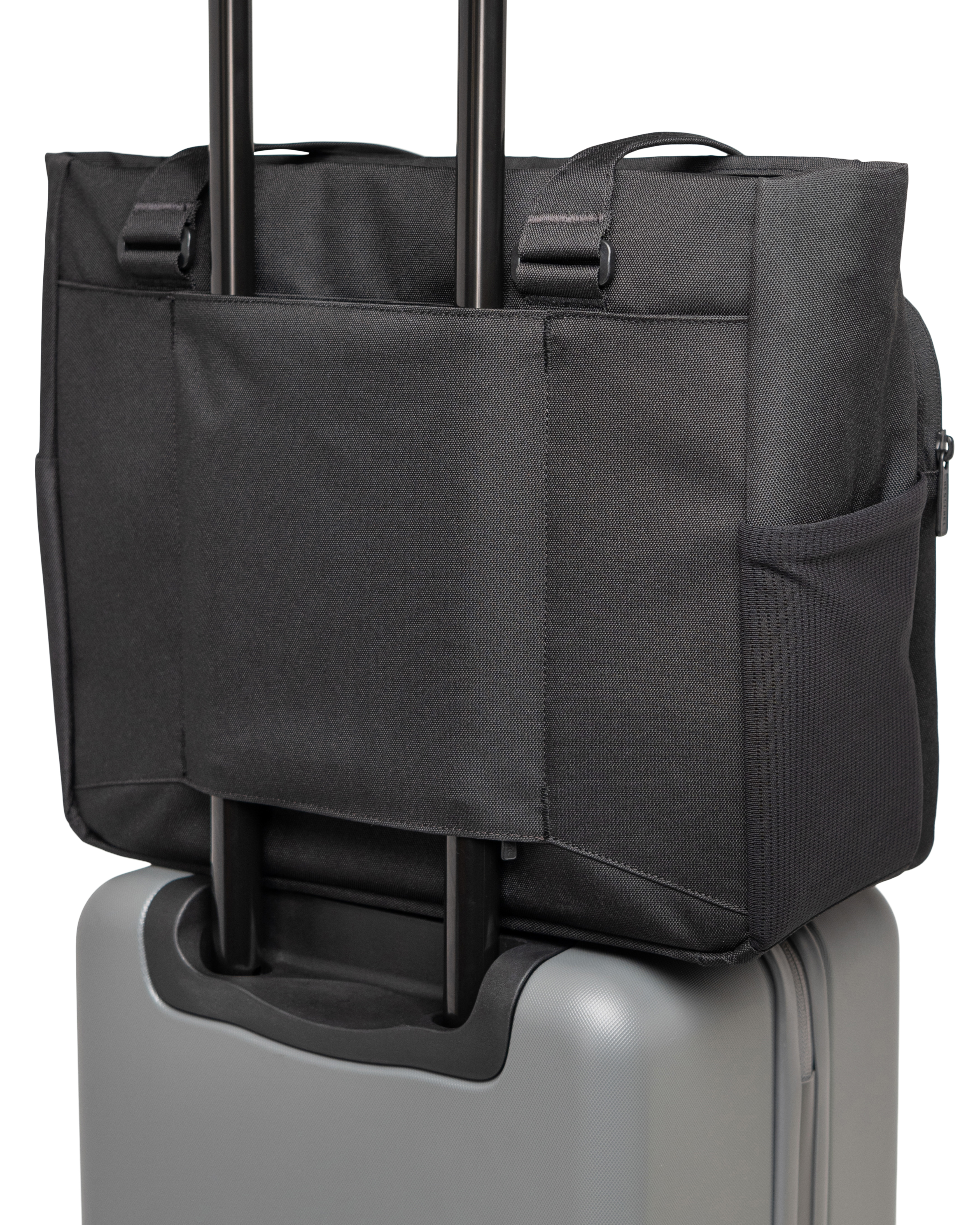 Herschel Kaslo Tote Tech features: main zipper snaps to the side, zippered laptop compartment, and luggage trolley sleeve for seamless travel.