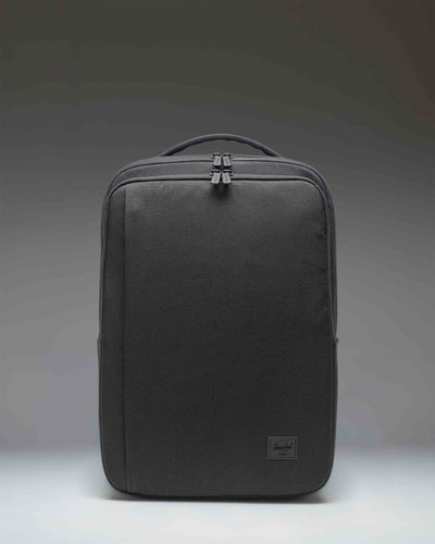 Herschel Supply Co. Kaslo Travel Backpack Tech in black. Clean front view showcasing the durable material and zippered compartments.