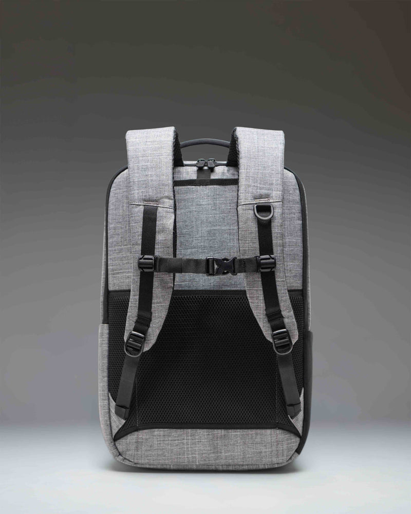 Herschel Supply Co. Kaslo Travel Backpack Tech in Raven Crosshatch gray, showing the durable textured design and functional travel compartments.