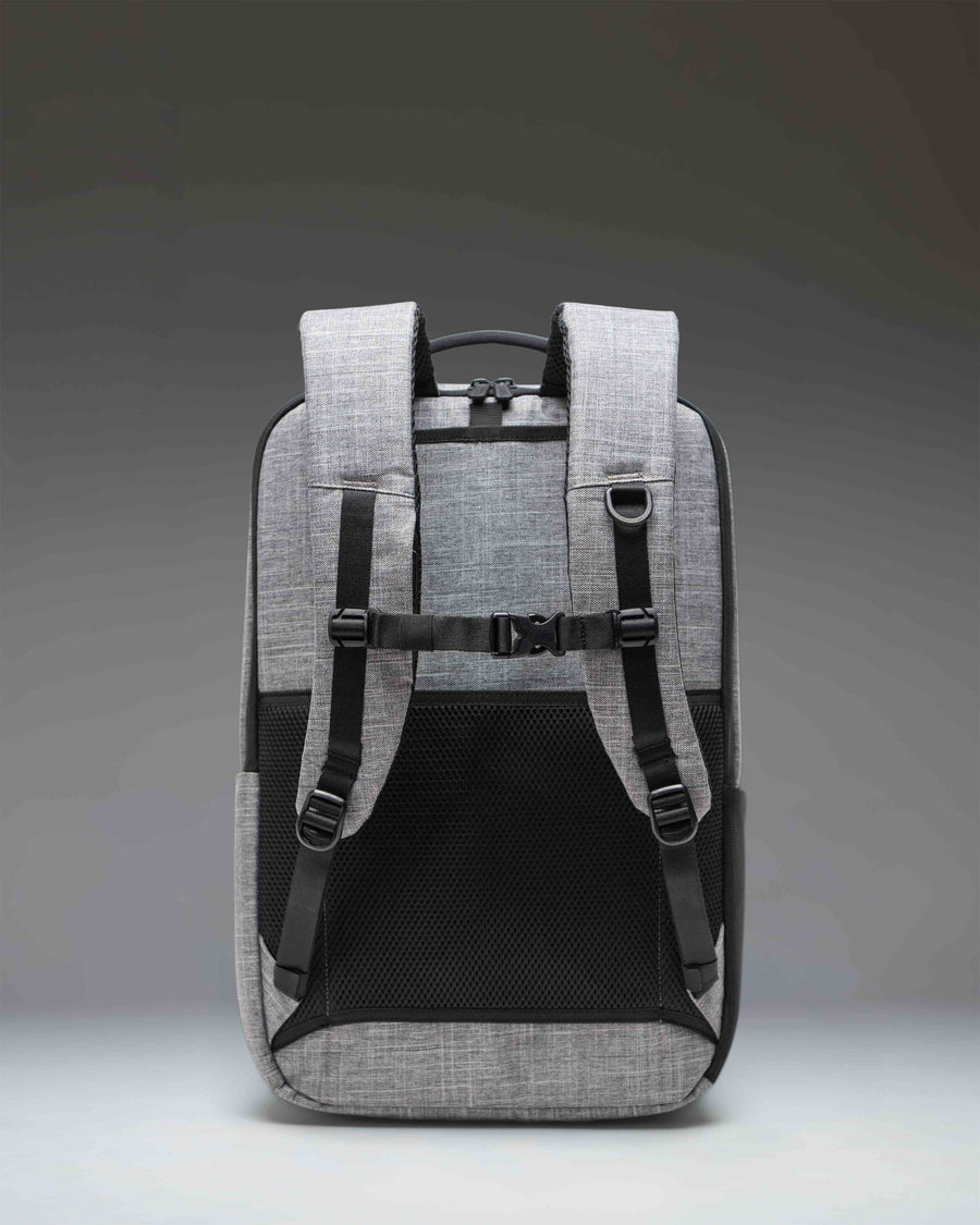 Herschel Supply Co. Kaslo Travel Backpack Tech in Raven Crosshatch gray, showing the durable textured design and functional travel compartments.