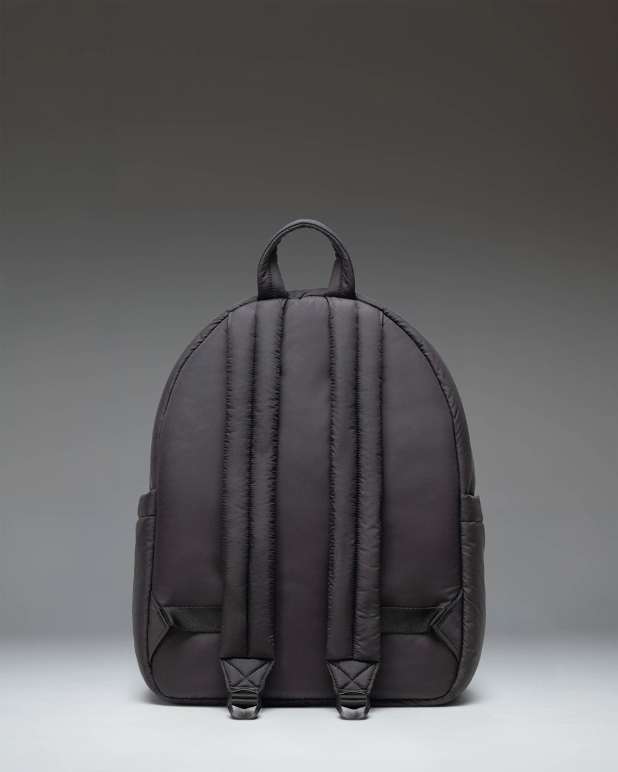 Herschel Supply Co. Cloudform Backpack in black, featuring a minimalist design with padded, lightweight fabric and adjustable shoulder straps.