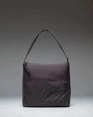 Herschel Supply Co Cloudform Tote in black, showcasing a clean, minimalist design with dual top handles and a spacious main compartment.