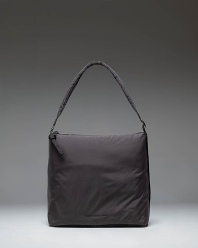 Herschel Supply Co Cloudform Tote in black, showcasing a clean, minimalist design with dual top handles and a spacious main compartment.