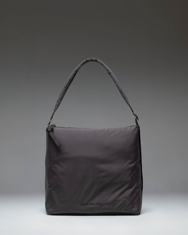 Herschel Supply Co Cloudform Tote in black, showcasing a clean, minimalist design with dual top handles and a spacious main compartment.