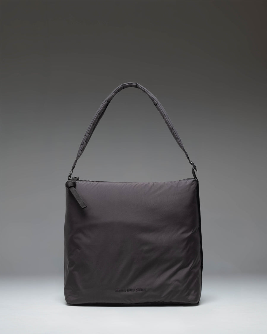 Herschel Supply Co Cloudform Tote in black, showcasing a clean, minimalist design with dual top handles and a spacious main compartment.